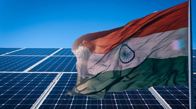 Solar Panels behind the Indian Flag